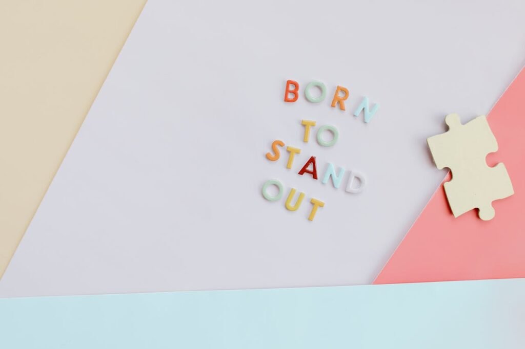 Puzzle Piece near Colorful Letters on a Surface 